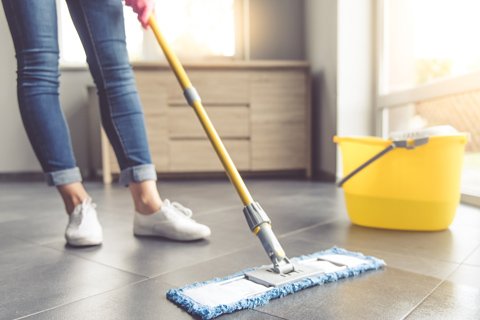 Cleaner cleaning home's floor, house with a brush In Calgary