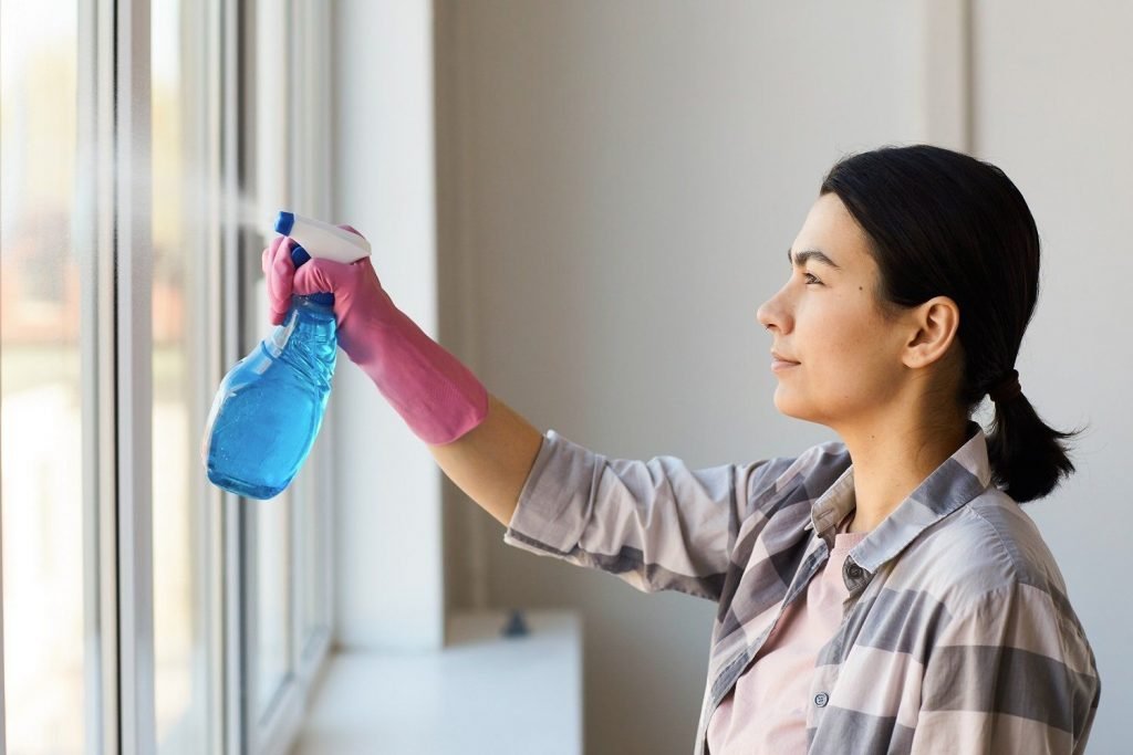 Lady Cleaner Cleaning-The-Window-With Glass, Open House Ceaning In Calgary