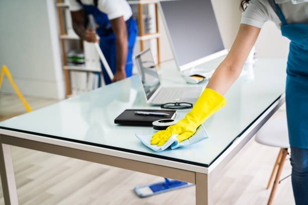 Young Male And Female Cleaners Cleaning Office in Calgary